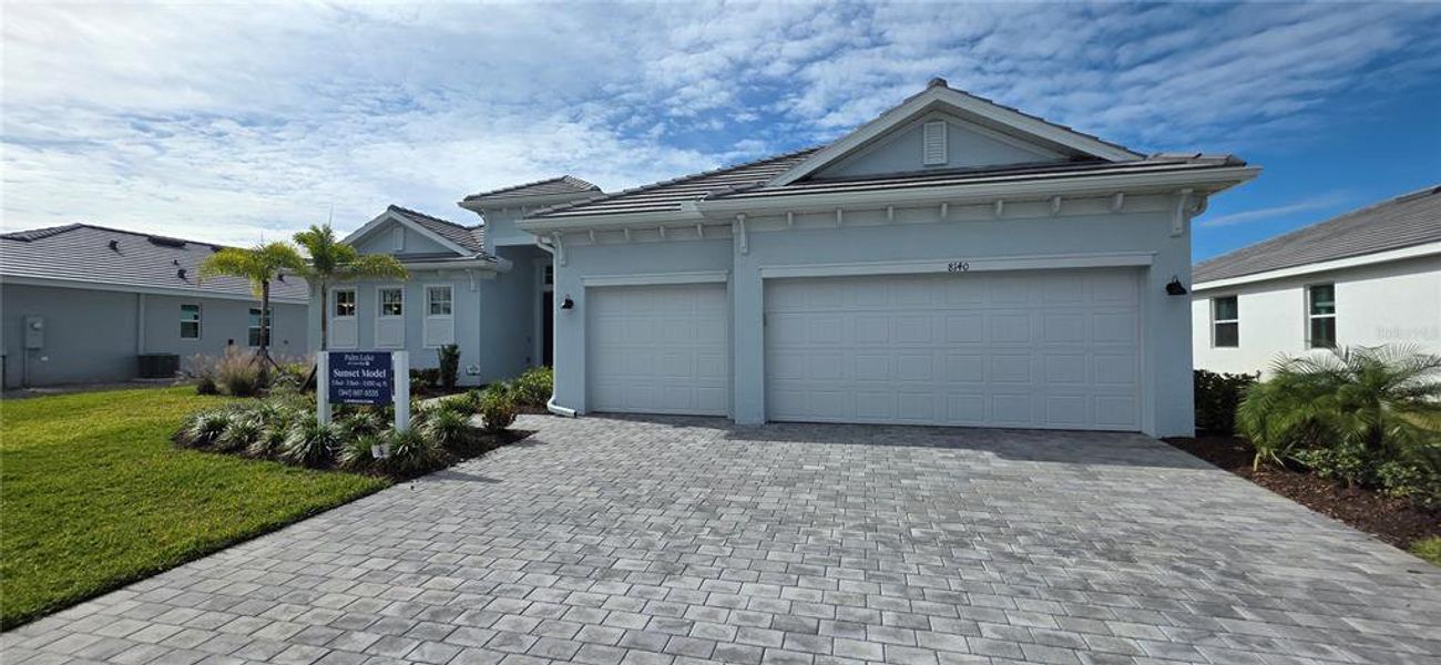 Front exterior of a new home in , Englewood, FL, highlighting curb appeal (Image 1). Front exterior of a new home in , Englewood, FL, highlighting curb appeal (Image 1).