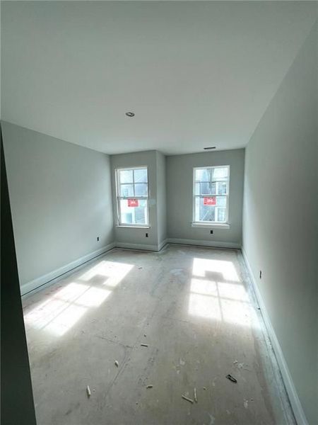 Spacious, unfurnished interior of a new home in The Village at Towne Lake, Woodstock (Image 50).