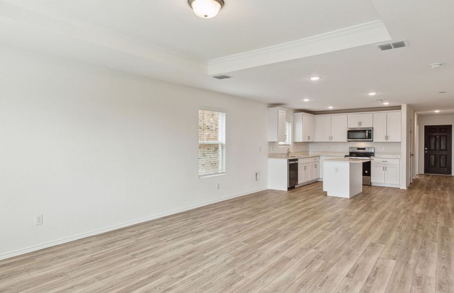 View of kitchen and dining areas from gathering room