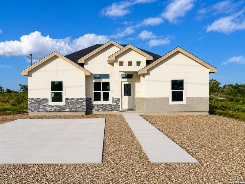 Front exterior of a new home in , Eagle Pass, TX, highlighting curb appeal (Image 11). Front exterior of a new home in , Eagle Pass, TX, highlighting curb appeal (Image 11).