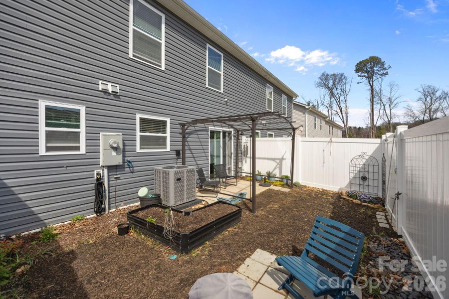 Exterior details and patio area of a home in , Candler (Image 21). Exterior details and patio area of a home in , Candler (Image 21).