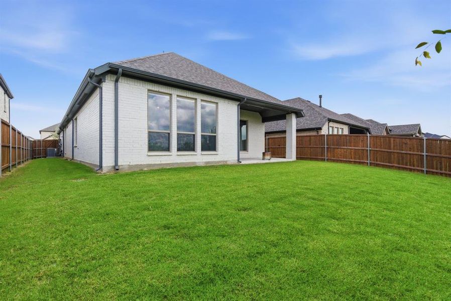 Exterior details and patio area of a home in Sweetgrass, Haslet (Image 3).