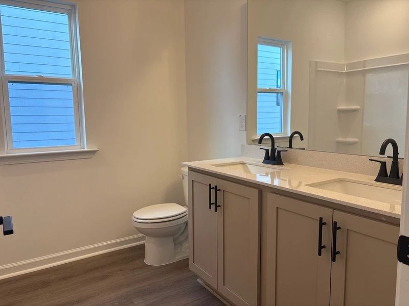 Bath 3 featuring the AW Collection® Foundry - Strong lines and deep tones define the space.