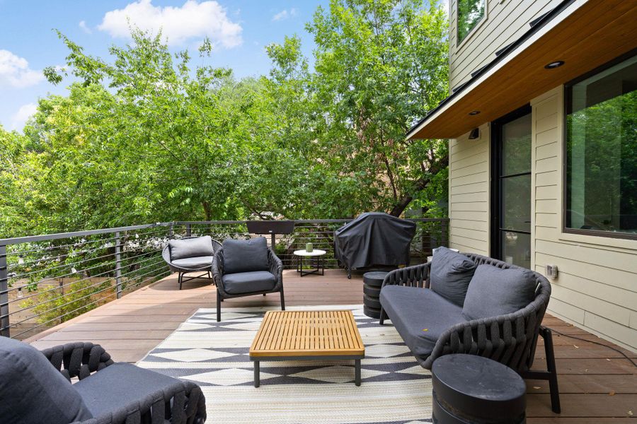 A spacious wooden deck provides an outdoor living area, perfect for entertaining or quiet relaxation amidst natural surroundings. A spacious wooden deck provides an outdoor living area, perfect for entertaining or quiet relaxation amidst natural surroundings.