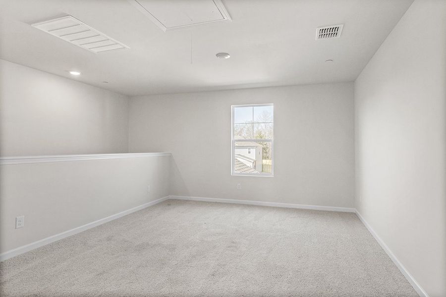 A room with a white wall and a painting on the wall. A room with a white wall and a painting on the wall.