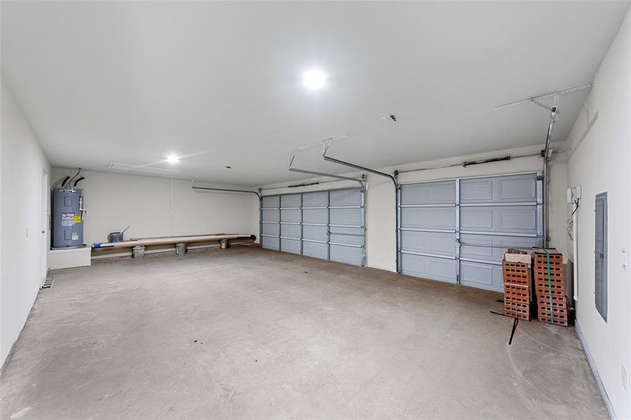 Garage featuring electric water heater