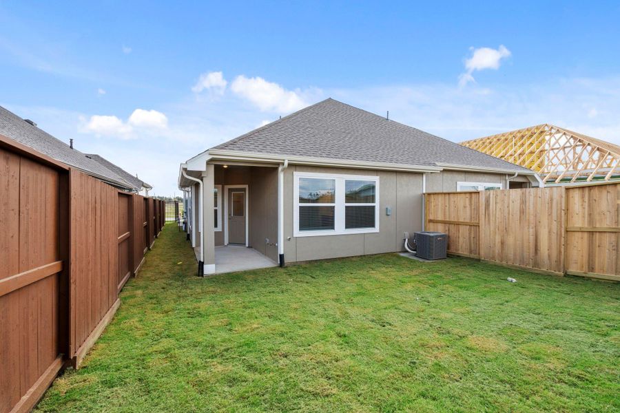 Exterior details and patio area of a home in Meridiana, Iowa Colony (Image 3).