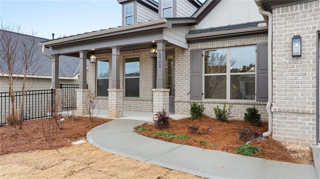 Exterior details and patio area of a home in Soleil Belmont Park, Canton (Image 34).
