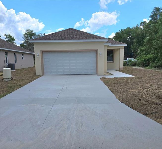 Front exterior of a new home in , Auburndale, FL, highlighting curb appeal (Image 1). Front exterior of a new home in , Auburndale, FL, highlighting curb appeal (Image 1).