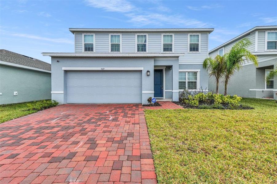 Front exterior of a new home in , St. Cloud, FL, highlighting curb appeal (Image 1). Front exterior of a new home in , St. Cloud, FL, highlighting curb appeal (Image 1).