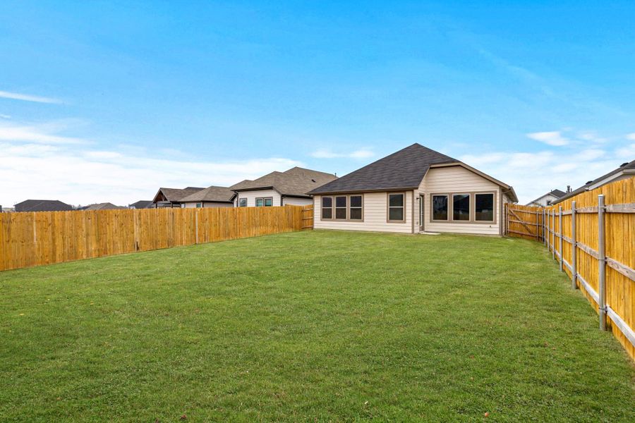 Exterior details and patio area of a home in Trinity Ranch, Elgin (Image 21).