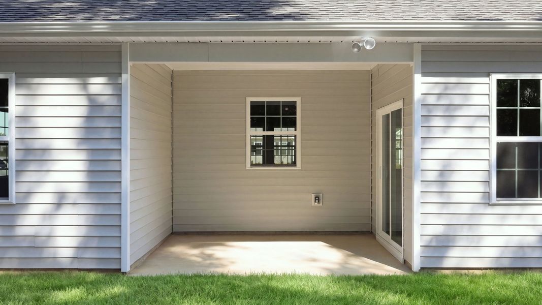 Exterior details and patio area of a home in Tyler - Home on the Lake, New Bern (Image 19).