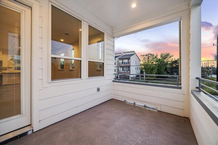 Enjoy peaceful evenings or morning coffee on this inviting second-floor balcony. Offering space for outdoor seating, the balcony is perfect for taking in the sunset or unwinding after a long day. With easy access from the interior, this private outdoor retreat enhances the living experience by blending comfort and fresh air.