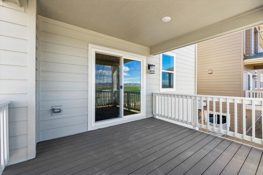 A deck with a railing and a wood deck with a white railing. A deck with a railing and a wood deck with a white railing.