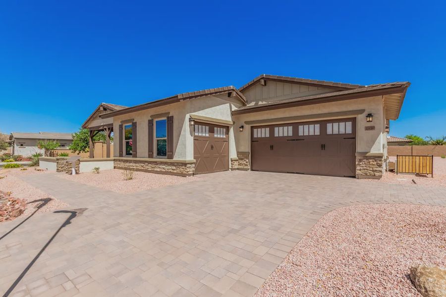 Front exterior of a new home in Bellero Estates, Queen Creek, AZ, highlighting curb appeal (Image 2).