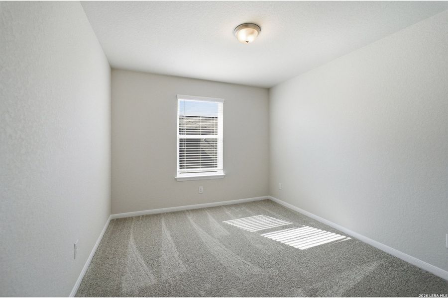 Spacious, unfurnished interior of a new home in The Woodlands at Medina Hills, Mico (Image 23).