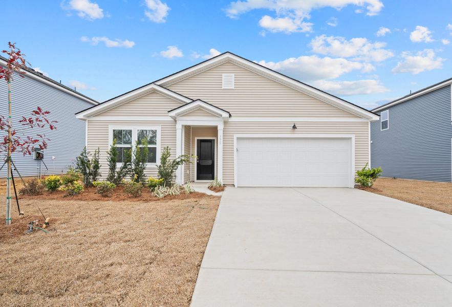 Front exterior of a new home in Bradford Pointe, Summerville, SC, highlighting curb appeal (Image 1). Front exterior of a new home in Bradford Pointe, Summerville, SC, highlighting curb appeal (Image 1).