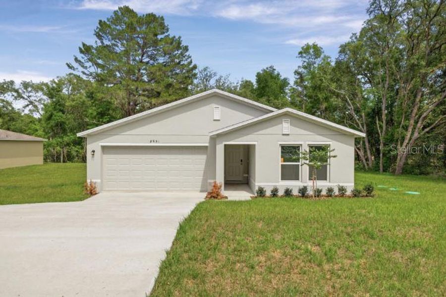 Front exterior of a new home in Citrus Springs, Citrus Springs, FL, highlighting curb appeal (Image 1). Front exterior of a new home in Citrus Springs, Citrus Springs, FL, highlighting curb appeal (Image 1).