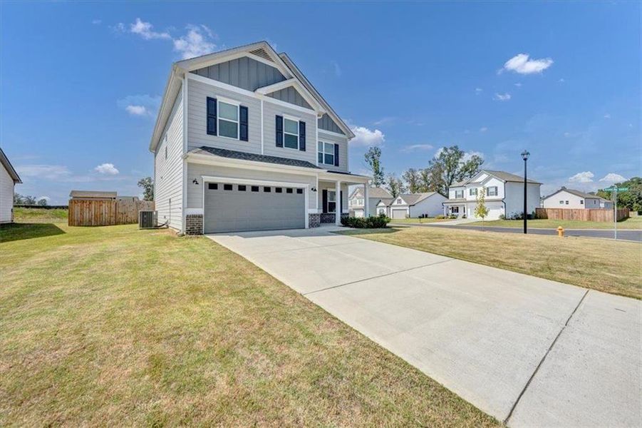 Front exterior of a new home in , Rome, GA, highlighting curb appeal (Image 26). Front exterior of a new home in , Rome, GA, highlighting curb appeal (Image 26).