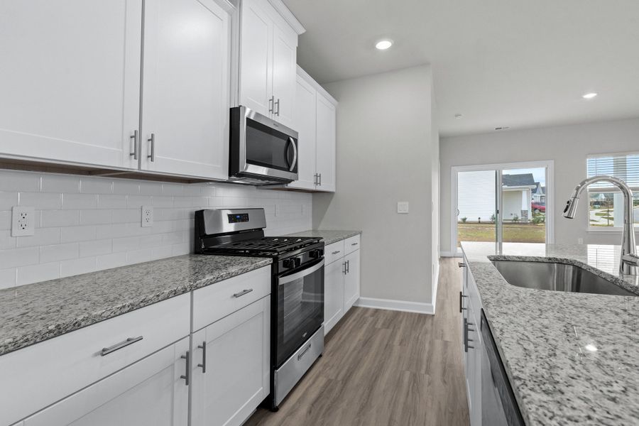 Furnished interior view inside a new home in Waterside - Boardwalk Series, Longs (Image 12). Furnished interior view inside a new home in Waterside - Boardwalk Series, Longs (Image 12).