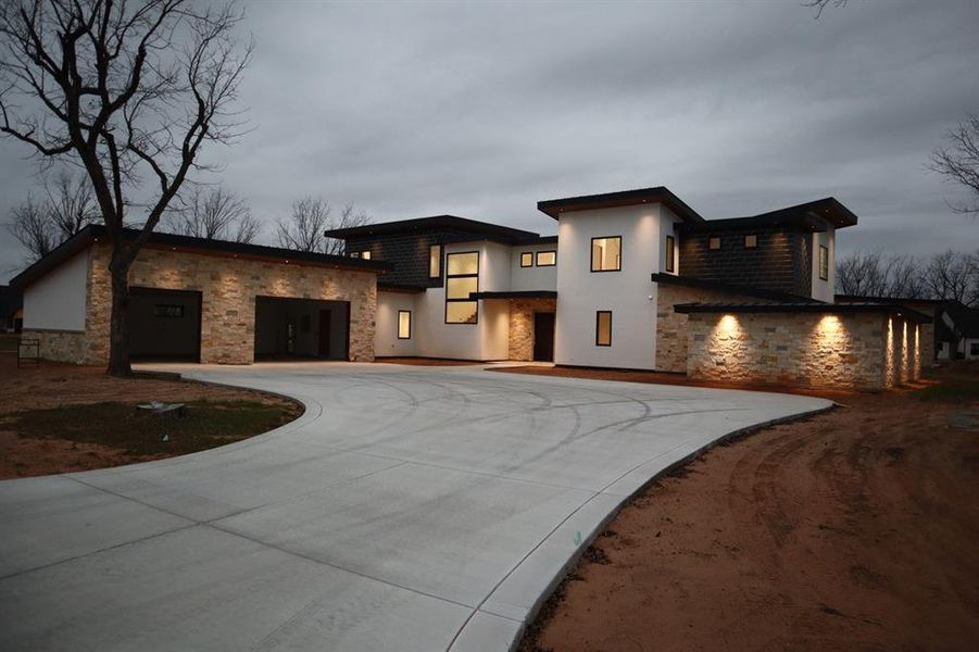 Front exterior of a new home in , Granbury, TX, highlighting curb appeal (Image 14).