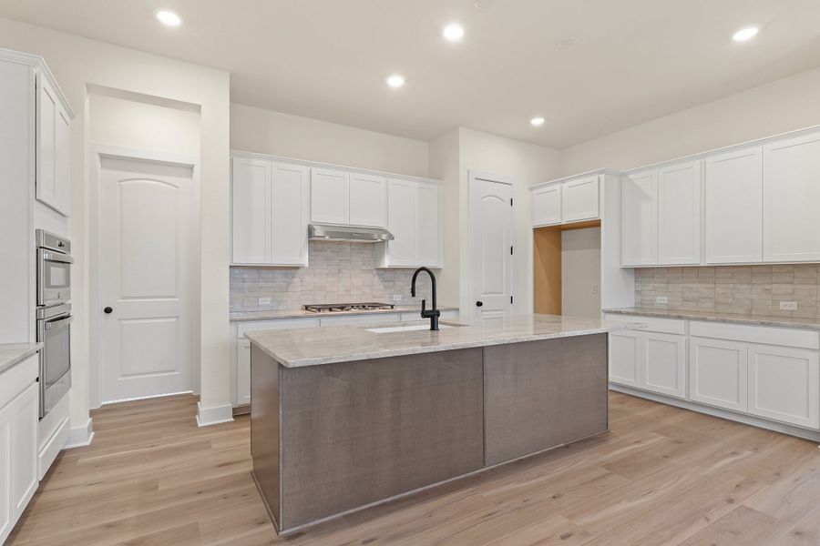 Representative furnished interior of a home built from the Waterville by Ashton Woods in The Trails at Carmel, Pflugerville (Image 6).