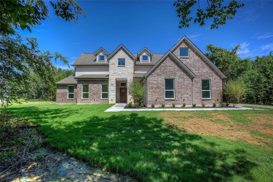 Front exterior of a new home in , Terrell, TX, highlighting curb appeal (Image 25). Front exterior of a new home in , Terrell, TX, highlighting curb appeal (Image 25).