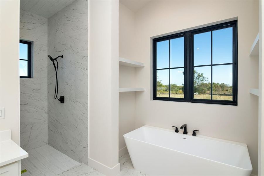 Bathroom featuring vanity and plus walk in shower