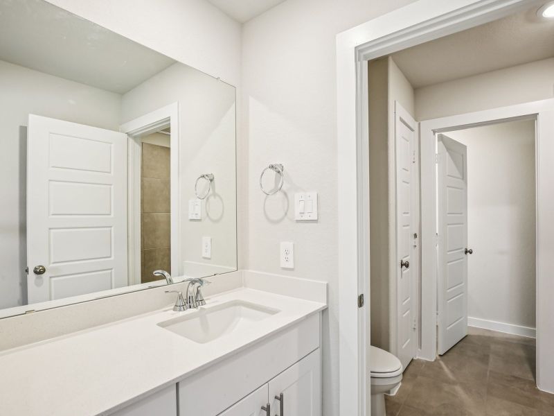 Furnished interior view inside a new home in Sundance Cove - Premier Series, Crosby (Image 11).