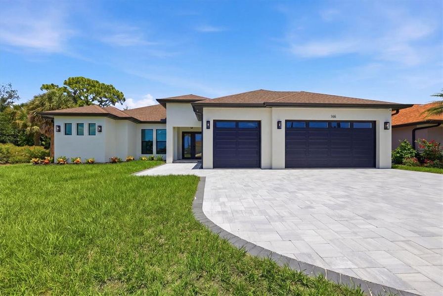 Front exterior of a new home in , Rotonda West, FL, highlighting curb appeal (Image 29).