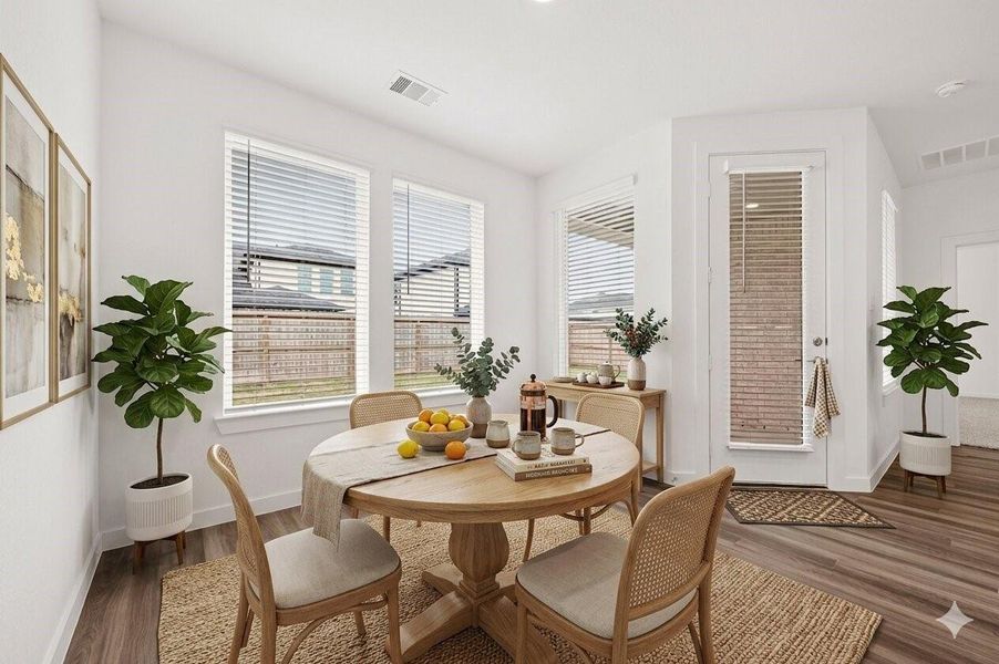 Breakfast Area: The bright breakfast area overlooks the backyard and opens to the covered patio. Virtual staging Breakfast Area: The bright breakfast area overlooks the backyard and opens to the covered patio. Virtual staging