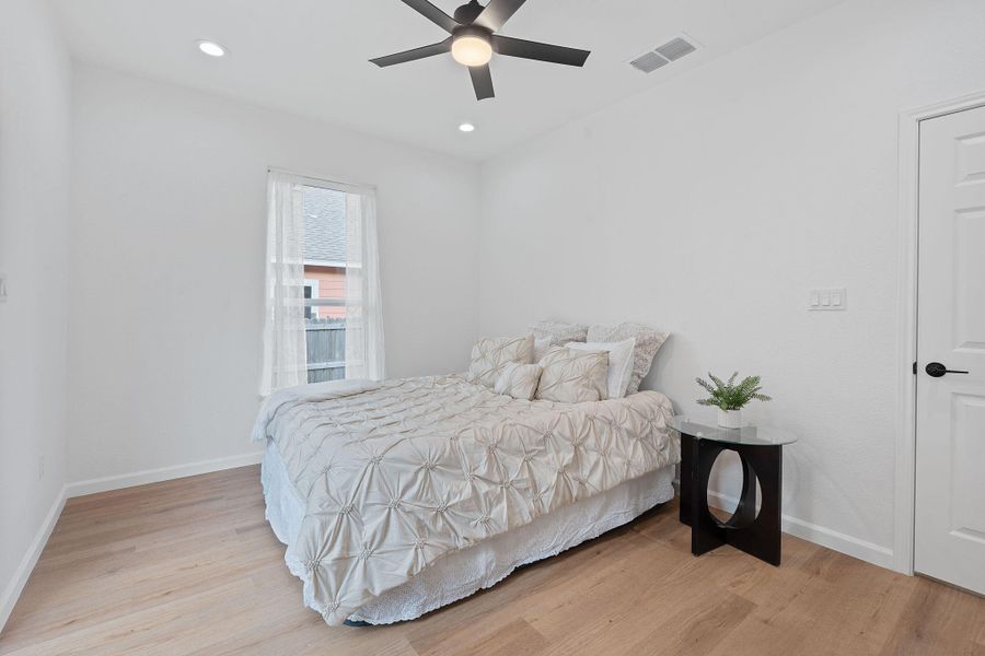 Bedroom featuring light wood-type flooring, recessed lighting, and ceiling fan