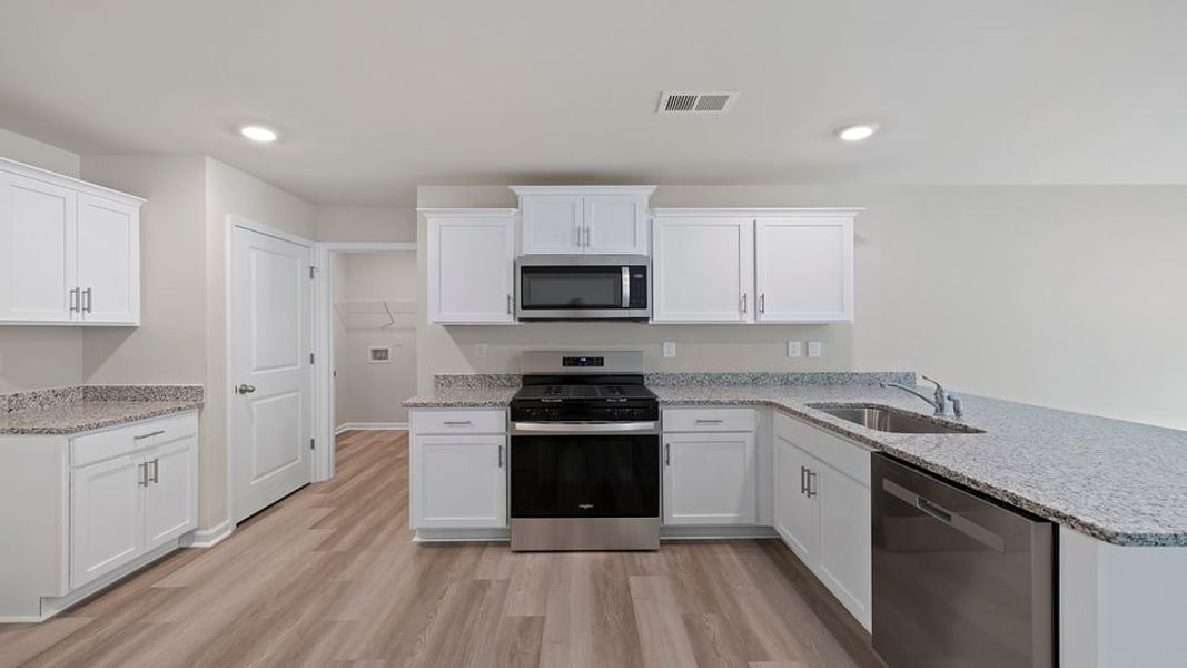 Furnished interior view inside a new home in Bentley Park, Greenwood (Image 6).