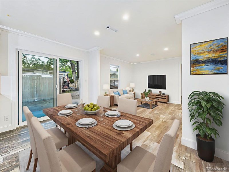 Virtually Staged Open dining area with sliding glass doors leading to the back patio.