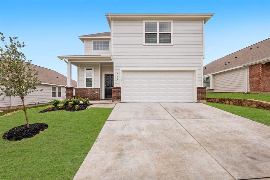 Front exterior of a new home in Retreat at Fossil Creek, Fort Worth, TX, highlighting curb appeal (Image 1). Front exterior of a new home in Retreat at Fossil Creek, Fort Worth, TX, highlighting curb appeal (Image 1).