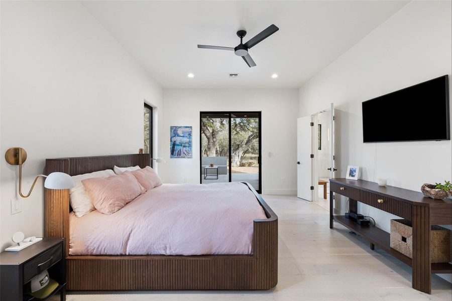Bedroom featuring wood finished floors, access to exterior, recessed lighting, and a ceiling fan