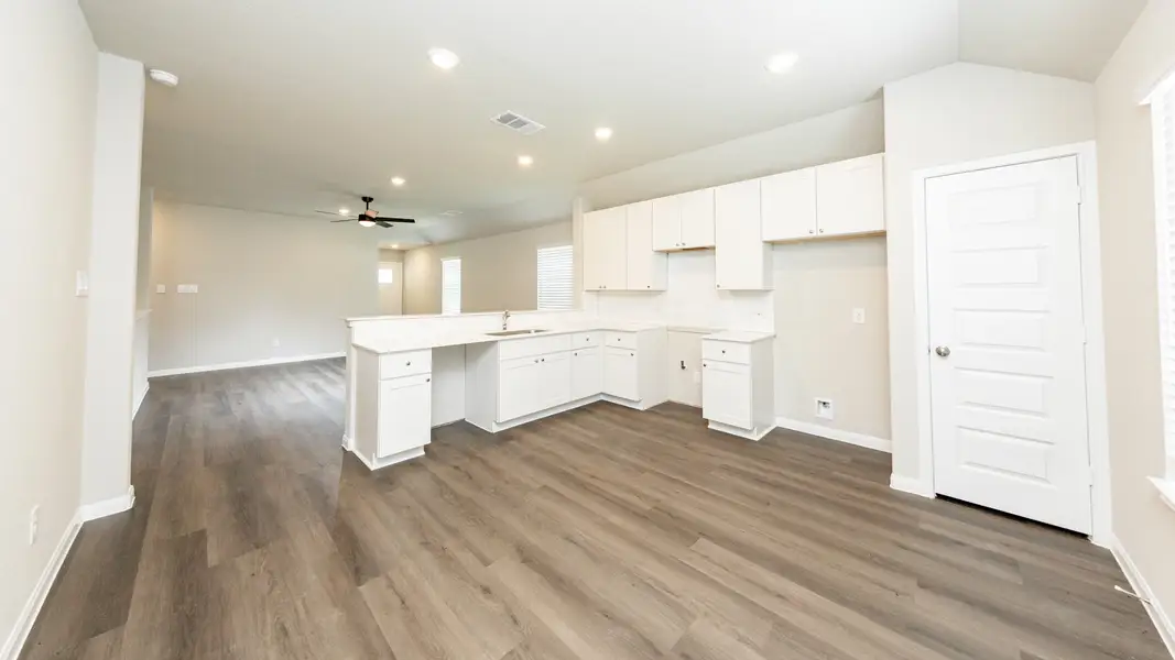 Kitchen and Dining Area to Family Room Kitchen and Dining Area to Family Room