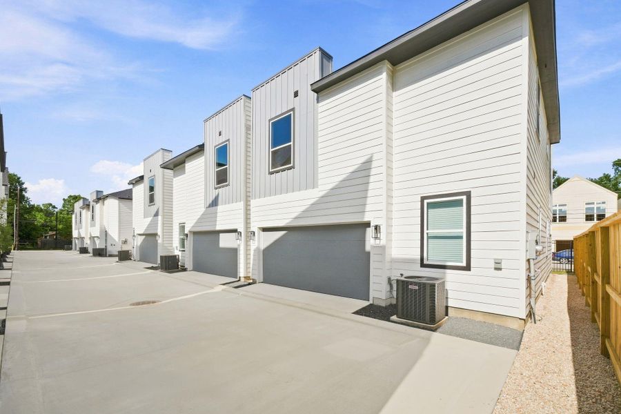 Desirable corner lot offering additional separation and open space along the side of the home, with a private two-car garage and convenient rear access.