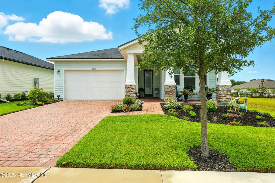 Front exterior of a new home in Reverie at TrailMark, St. Augustine, FL, highlighting curb appeal (Image 17). Front exterior of a new home in Reverie at TrailMark, St. Augustine, FL, highlighting curb appeal (Image 17).