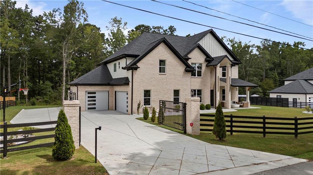 Front exterior of a new home in , Lawrenceville, GA, highlighting curb appeal (Image 1).