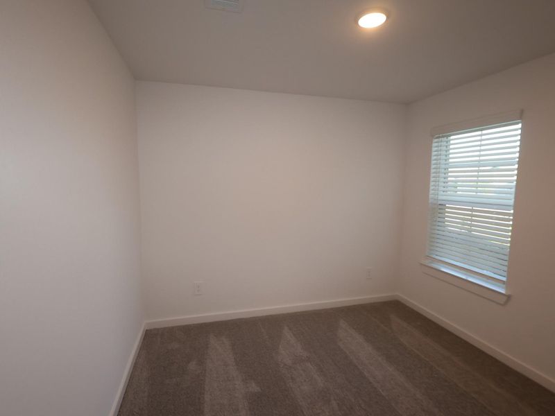 Spacious, unfurnished interior of a new home in Pinewood at Grand Texas, New Caney (Image 24).