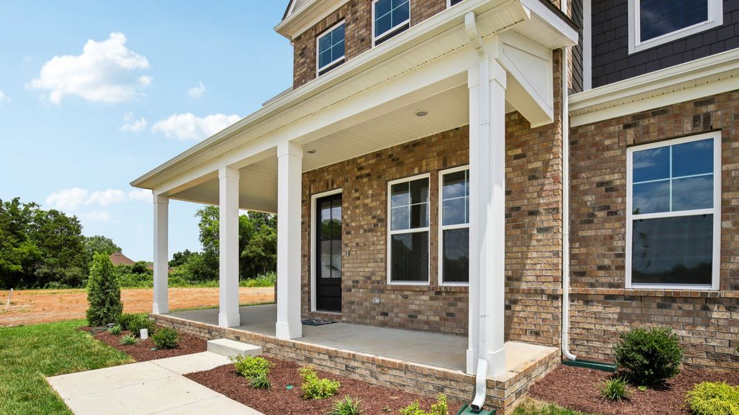 Exterior front entryway with covered porch Exterior front entryway with covered porch