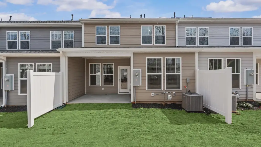 Superior curb appeal continues to the back with a refined, covered outdoor living space located in Greenville, SC