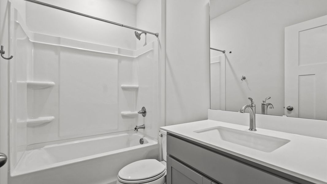 Elegant bath retreat with designer finishes and a clean, timeless aesthetic