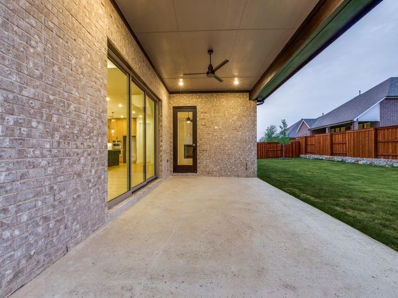 Featuring a multi panel sliding door, it's easy to take the party outside to this lovel covered patio and fenced back yard!