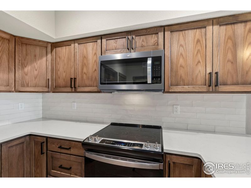 Tiled backsplash and new appliances.