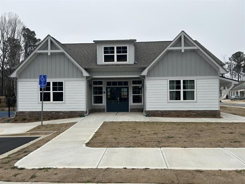 Front exterior of a new home in Cooks Farm, Woodstock, GA, highlighting curb appeal (Image 32). Front exterior of a new home in Cooks Farm, Woodstock, GA, highlighting curb appeal (Image 32).