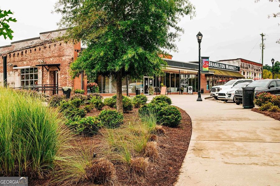 Front exterior of a new home in Rosewood Lake Estates, Hoschton, GA, highlighting curb appeal (Image 43).