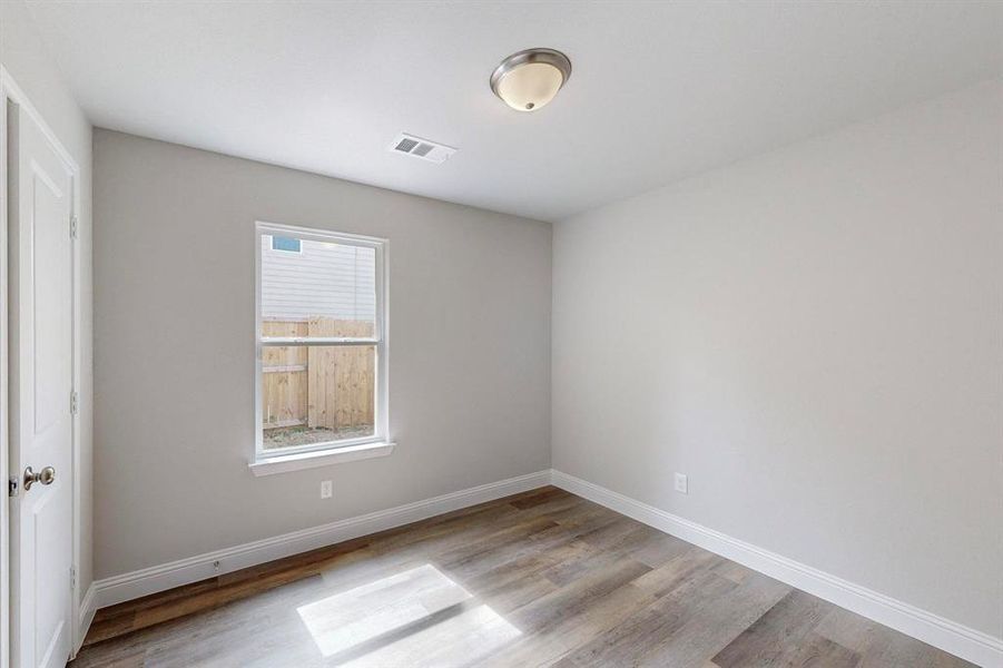 Spare room featuring light hardwood / wood-style floors