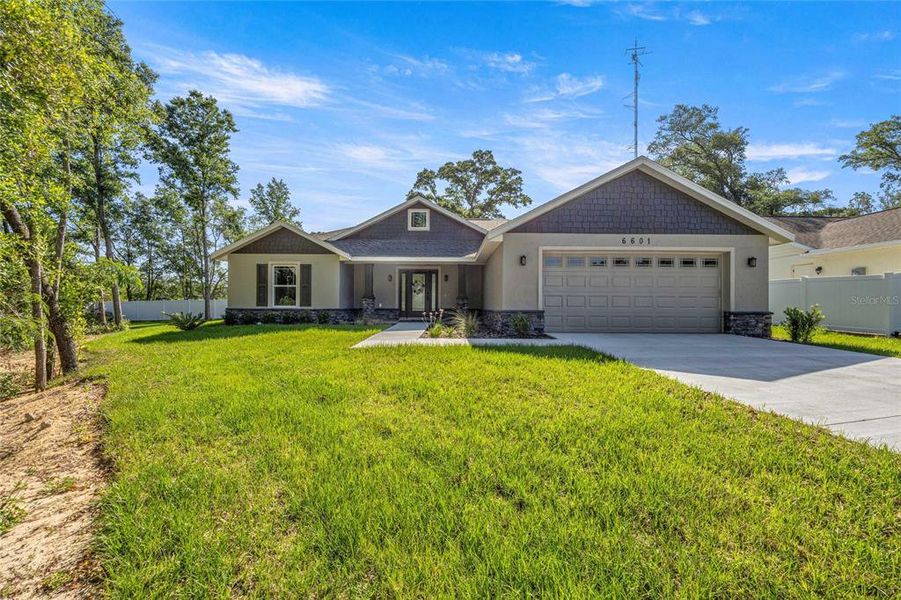 Front exterior of a new home in , Ocala, FL, highlighting curb appeal (Image 29).